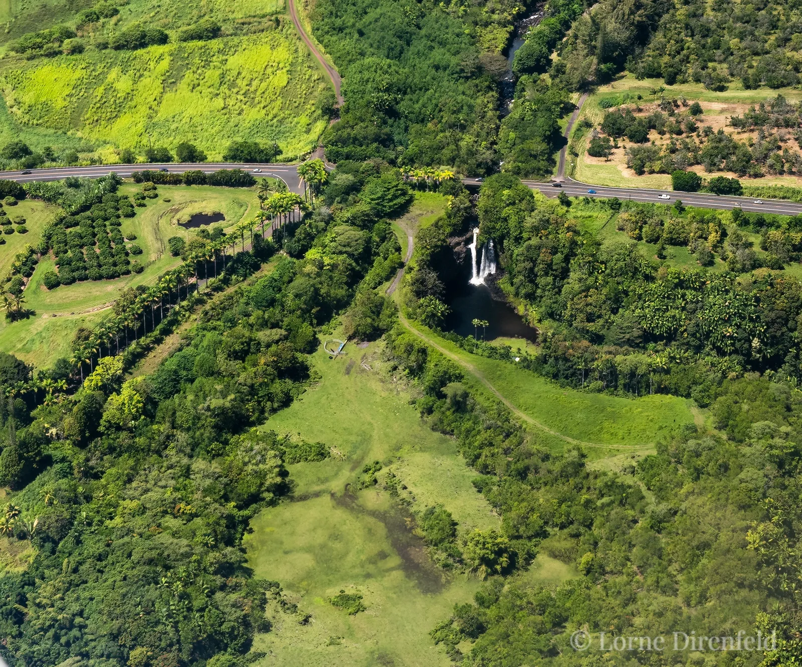 A beautiful morning, with a cascading waterfall on the Hamakua coast of the Big Island of Hawaii