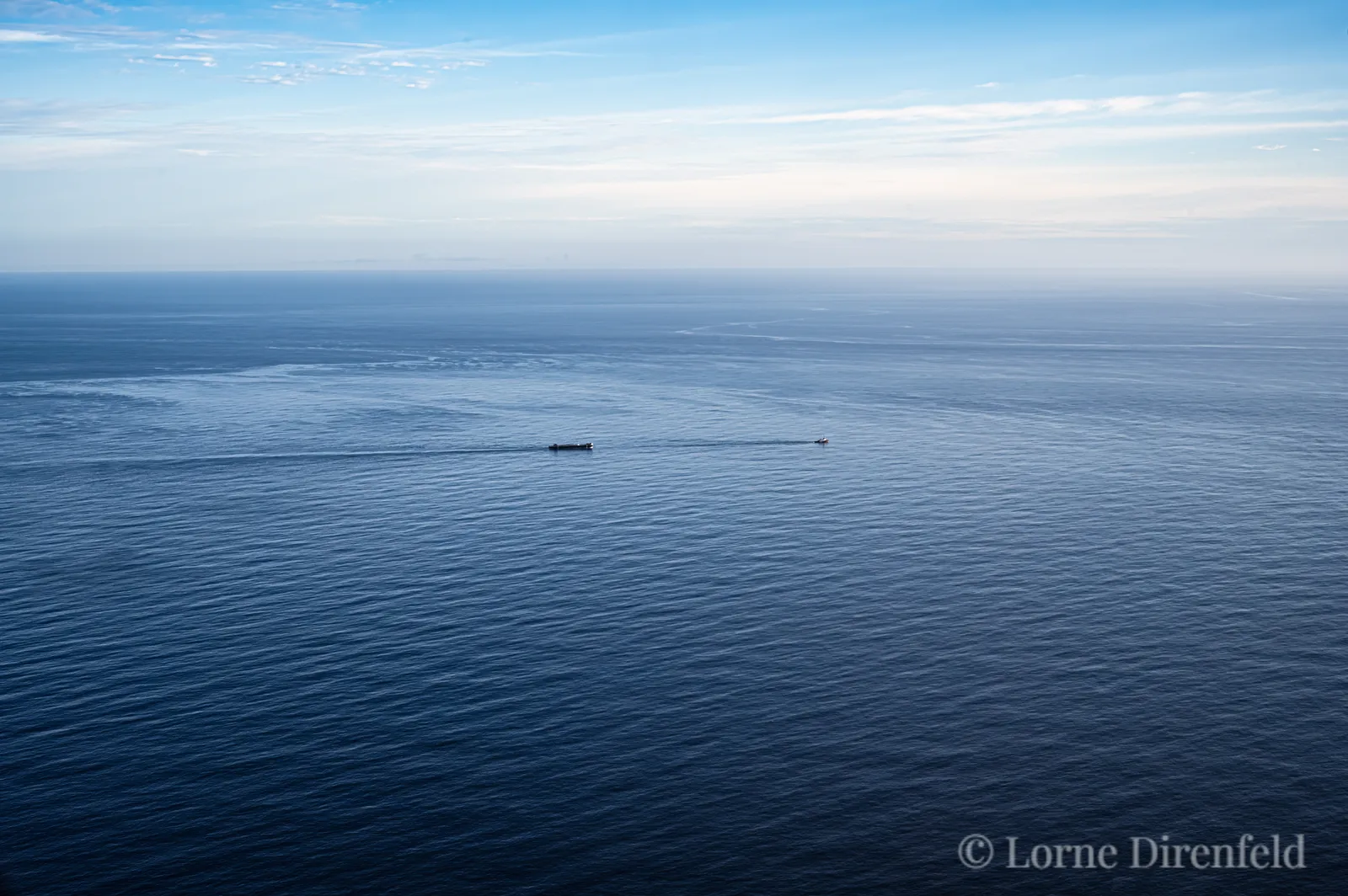 Tug and barge lifeline in Hawaii, on a calm ocean day . . .