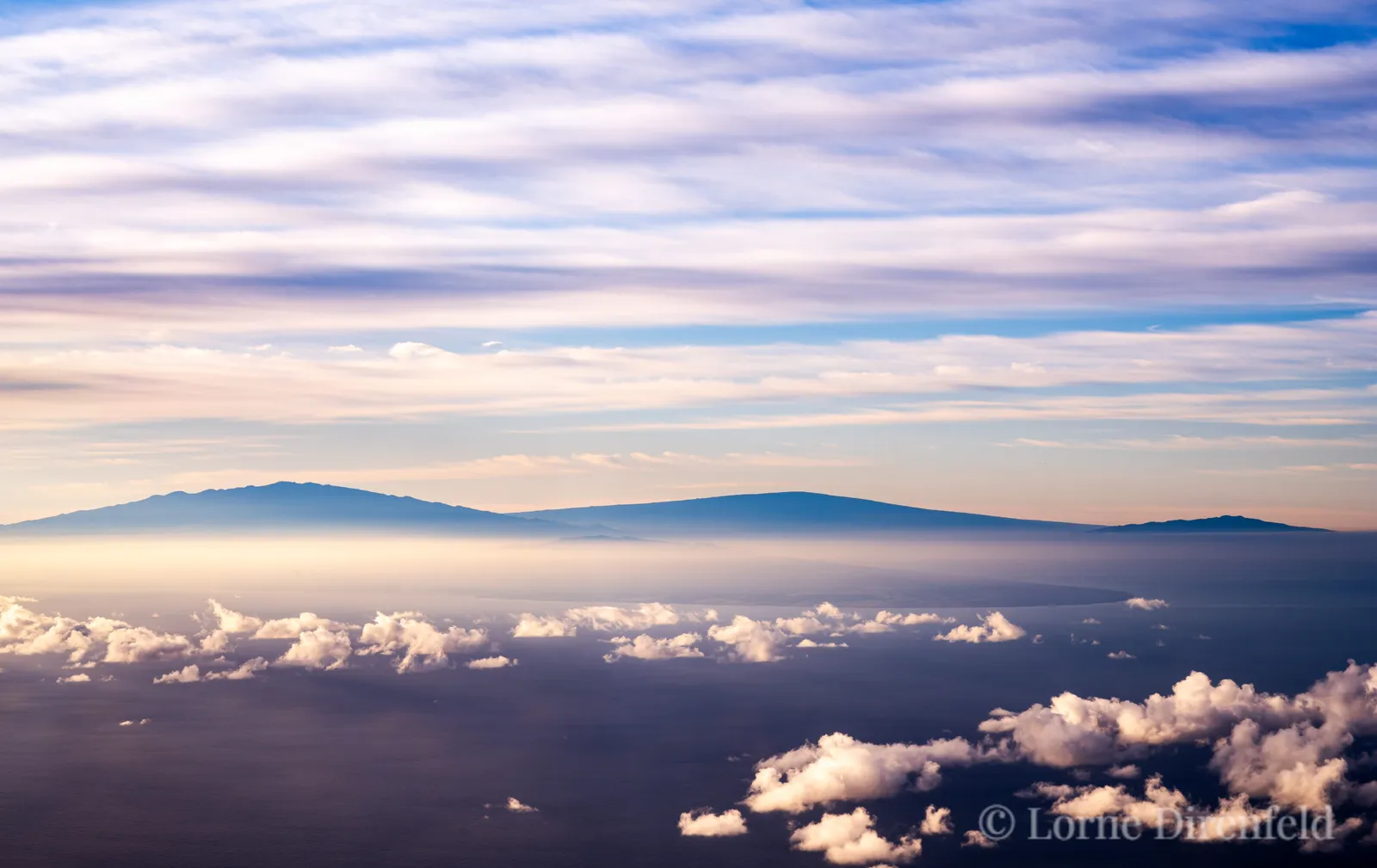 Mauna Kea, Mauna Loa and Hualalai mountains on the Big Island of Hawaii in the early morning . . .